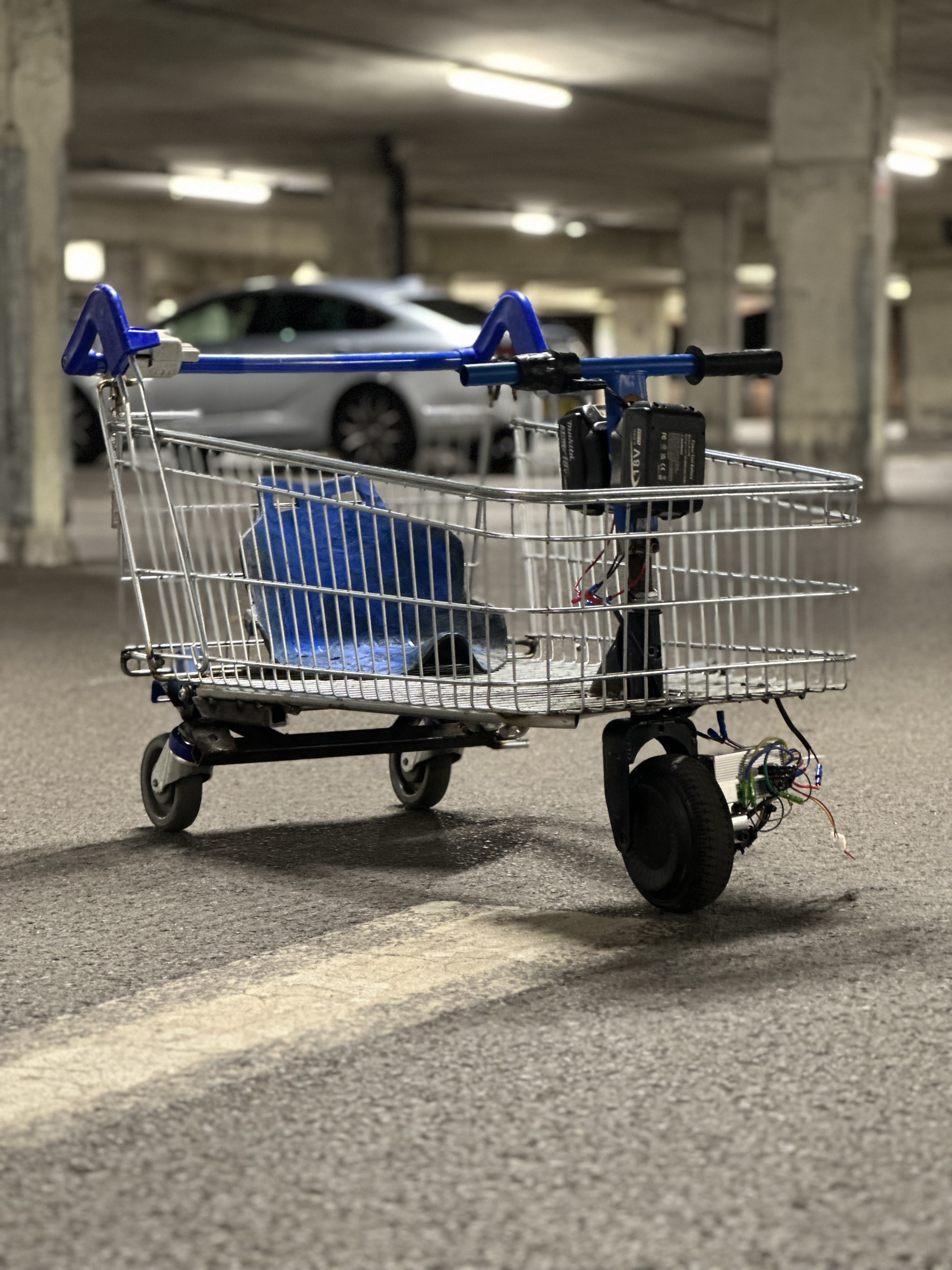 A modified shopping trolley turned into a drift cart in a car park